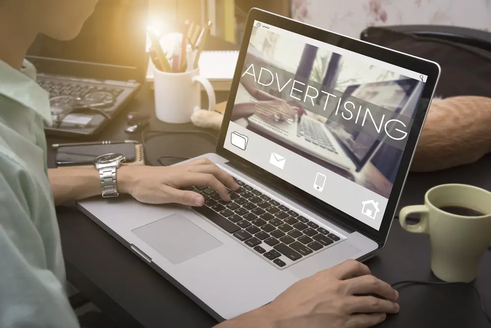 business hand typing on a laptop keyboard