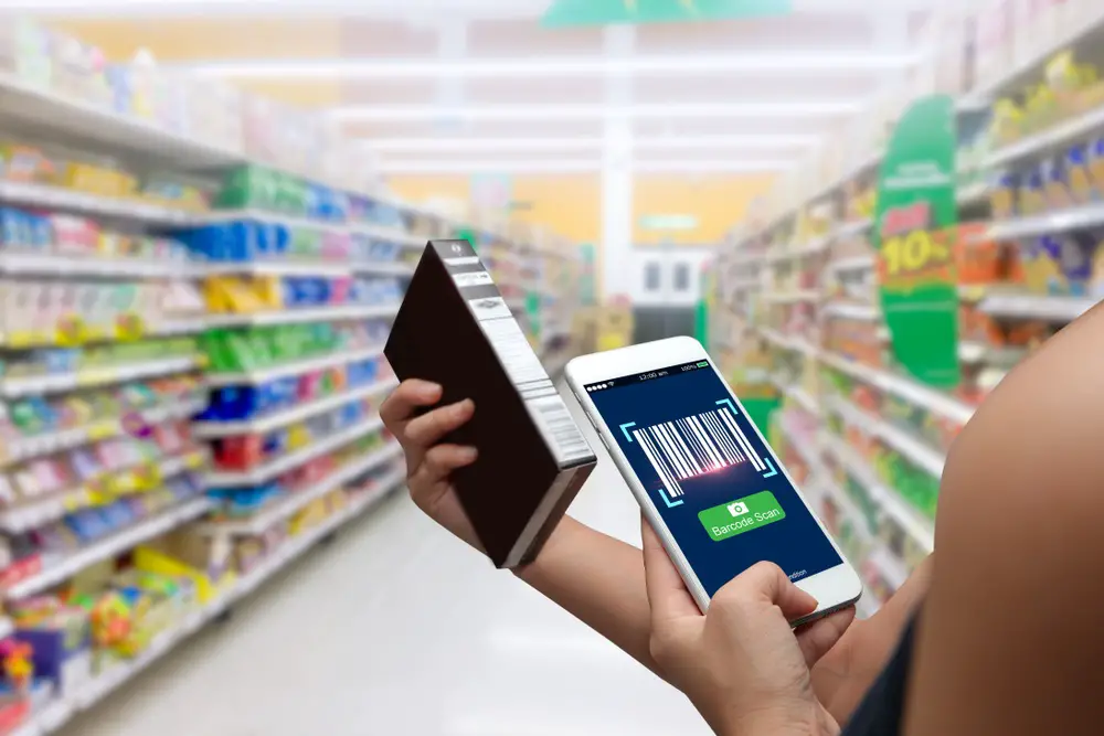 hands using barcode scan for information of product in supermarket 